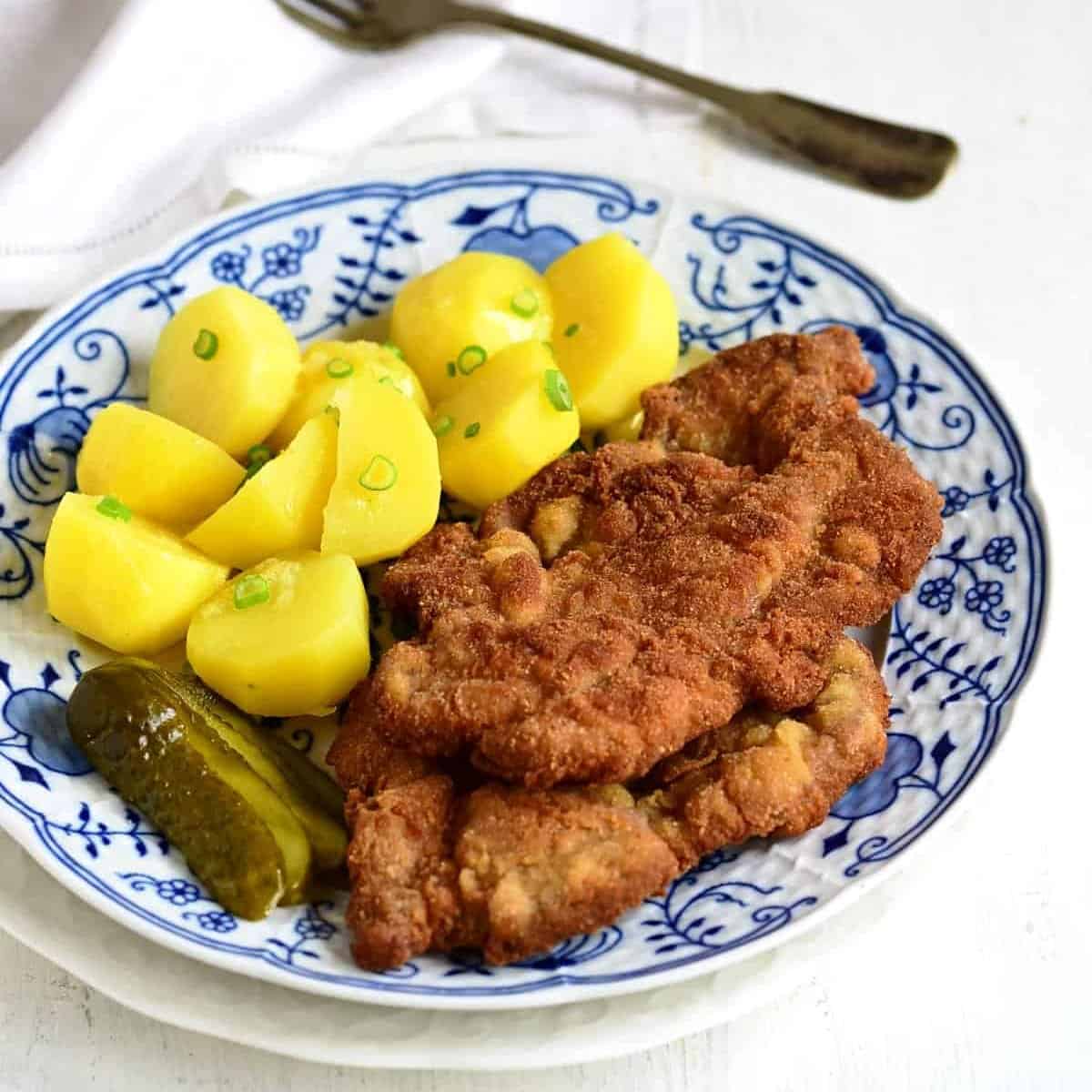 Czech Řízek Schnitzel served with potatoes.