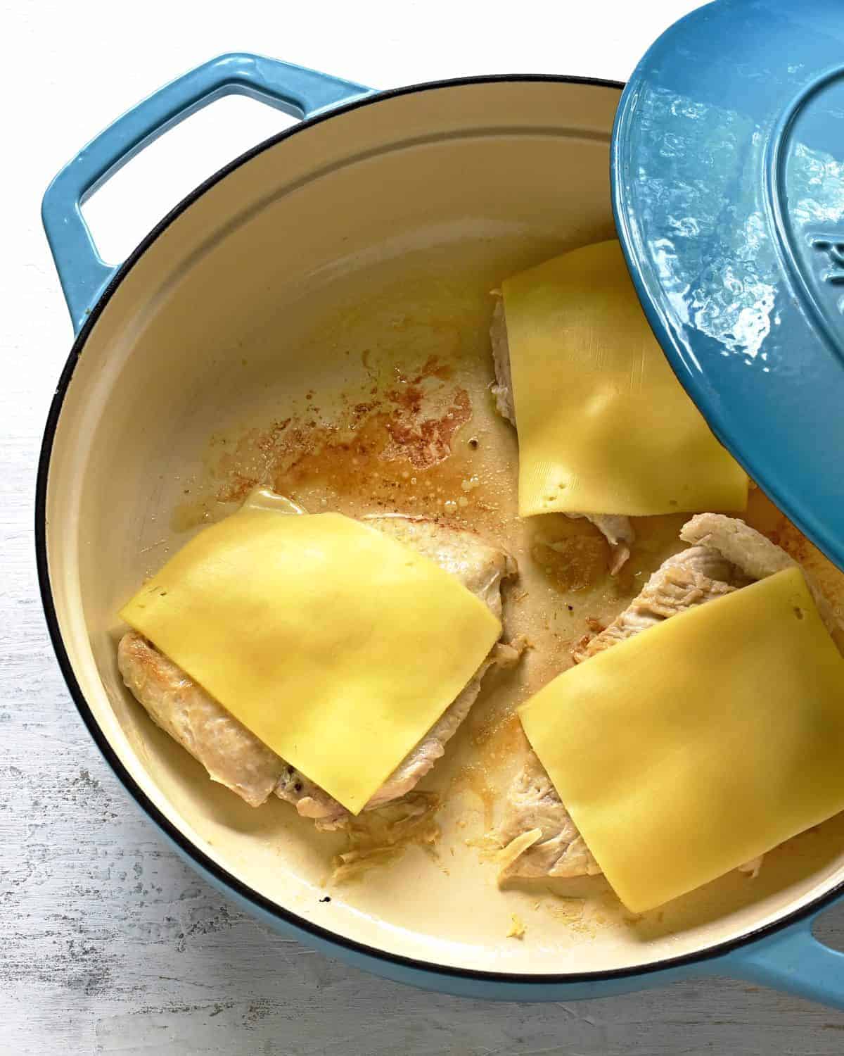 chicken breast steak fried, topped with sliced cheese