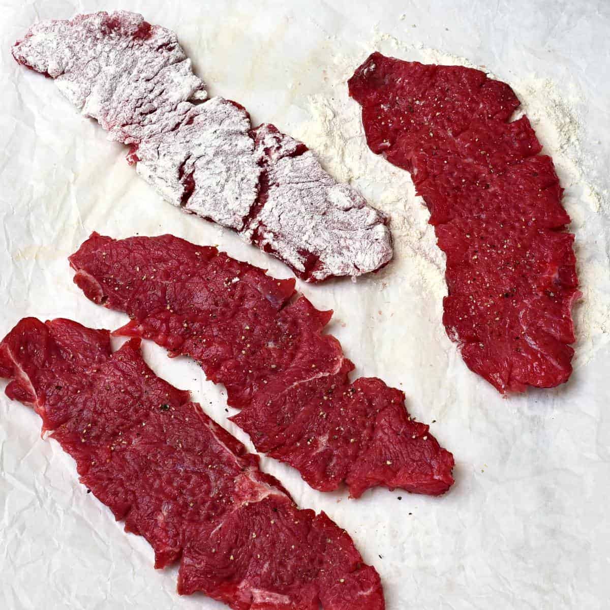 dreadging steaks in the flour