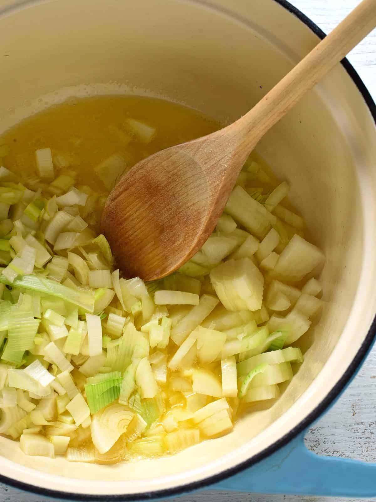 frying onion in a pot