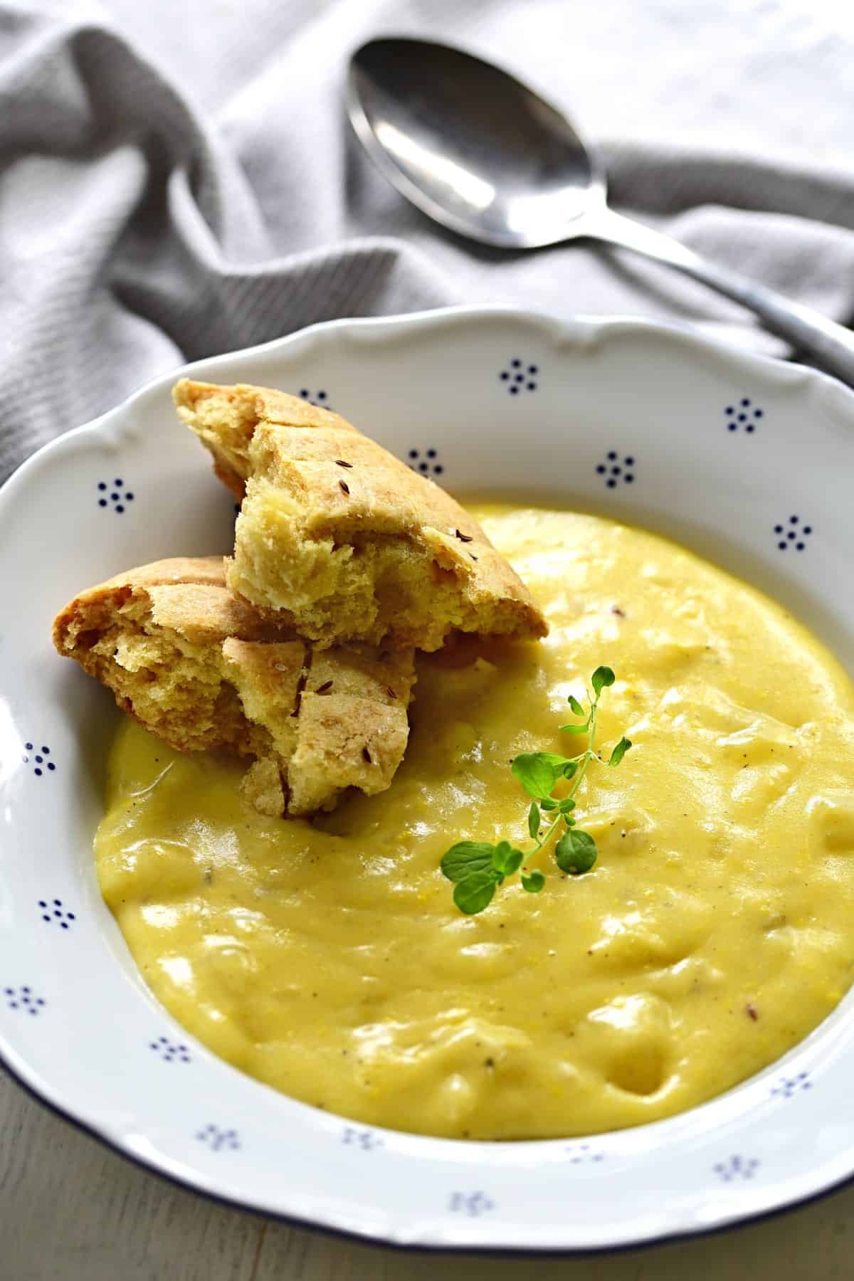 Krajanec served with potato sauce.