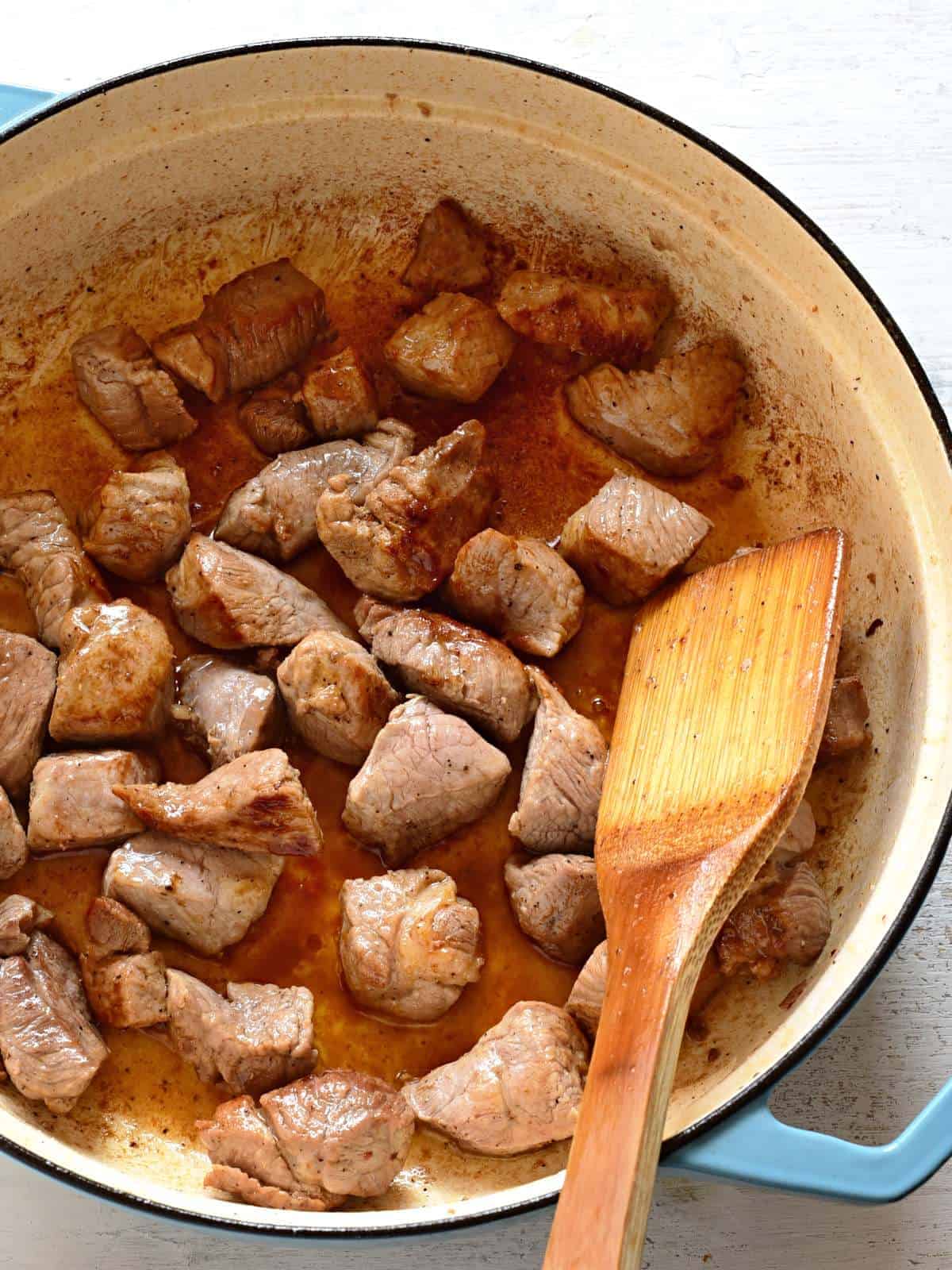 Making pork goulash - browning meat.