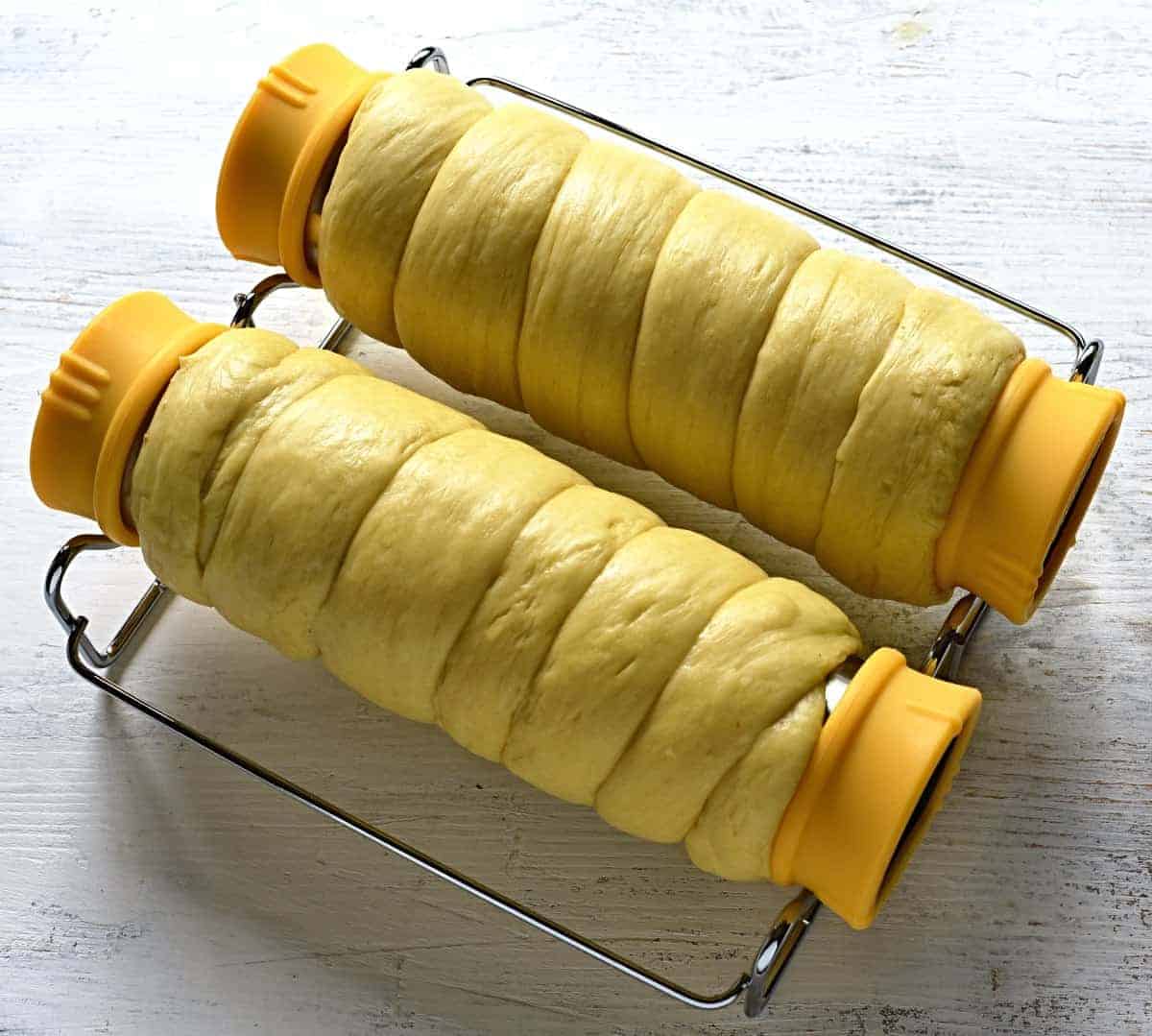 Making Czech trdelnik pastry.