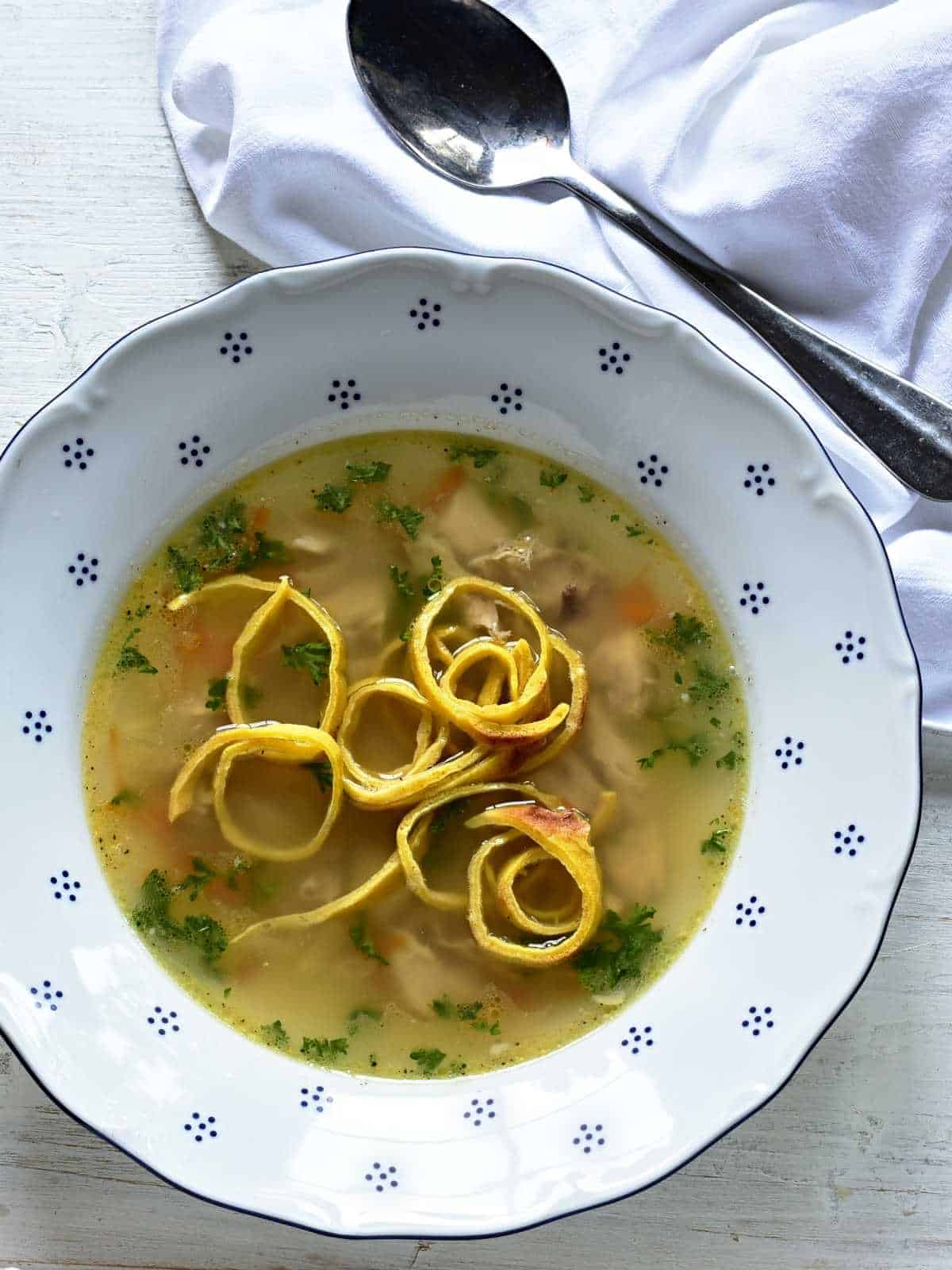 A clear soup with celestýnské nudle insert.