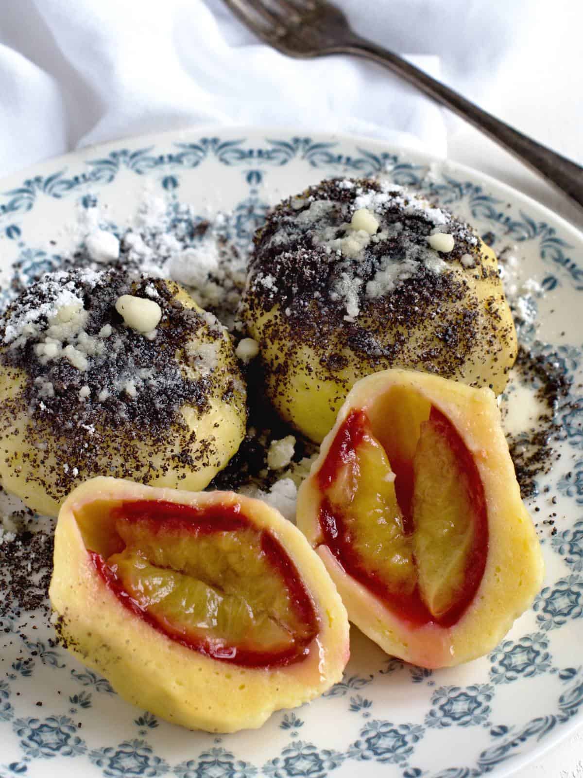 Plum dumplings topped with poppyseed.