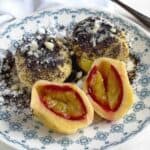 Plum dumplings with poppyseed topping.