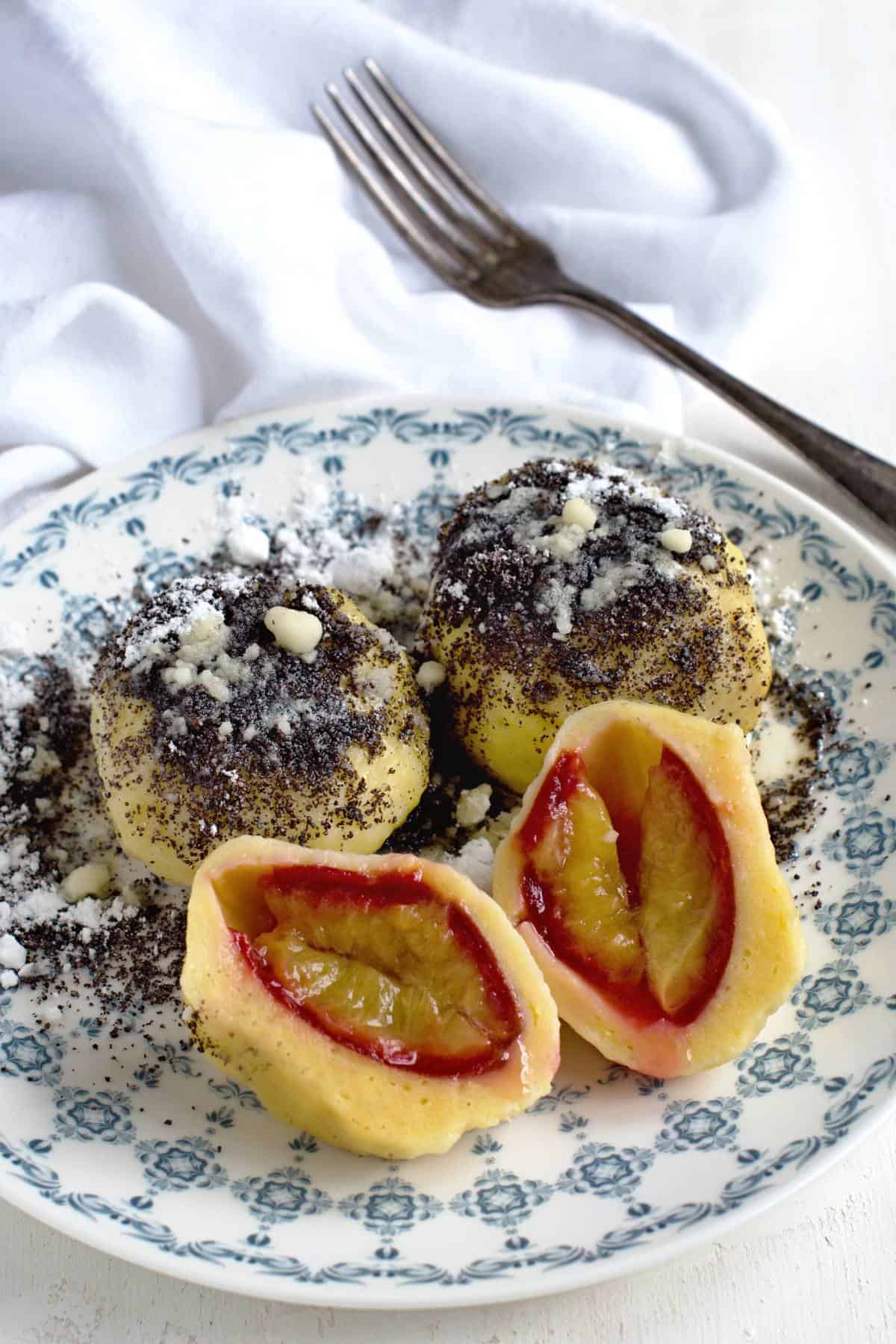 Plum dumplings with poppyseed topping.