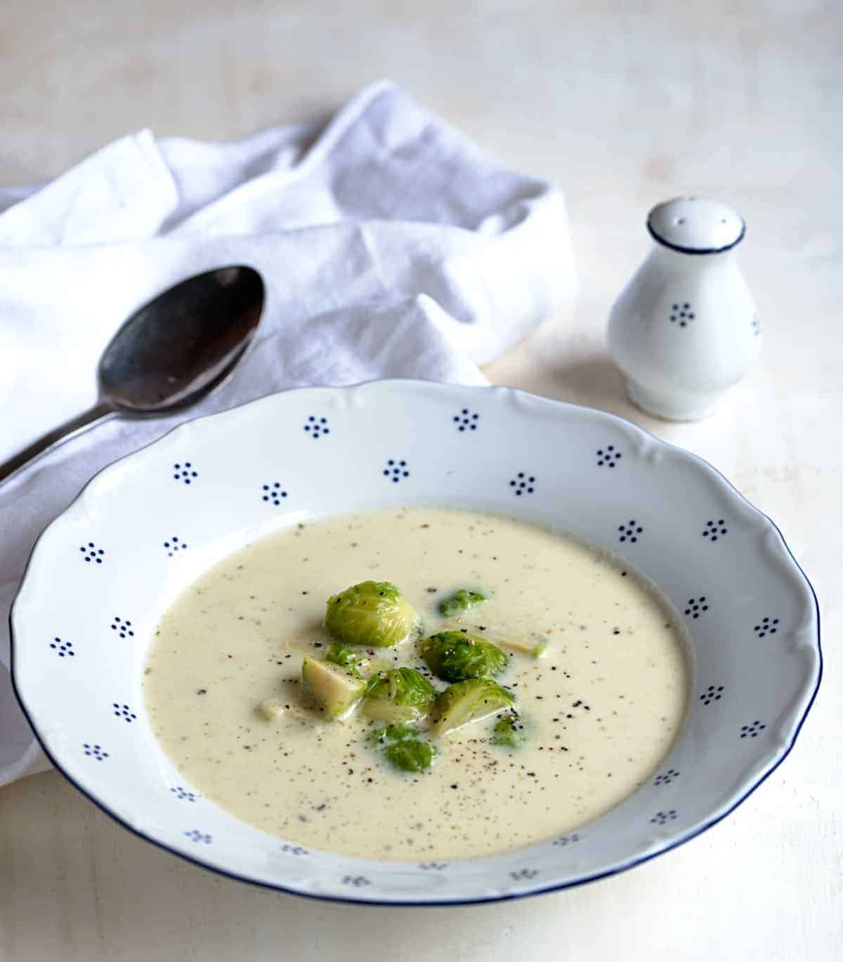 Brussels sprouts soup served in a bowl.