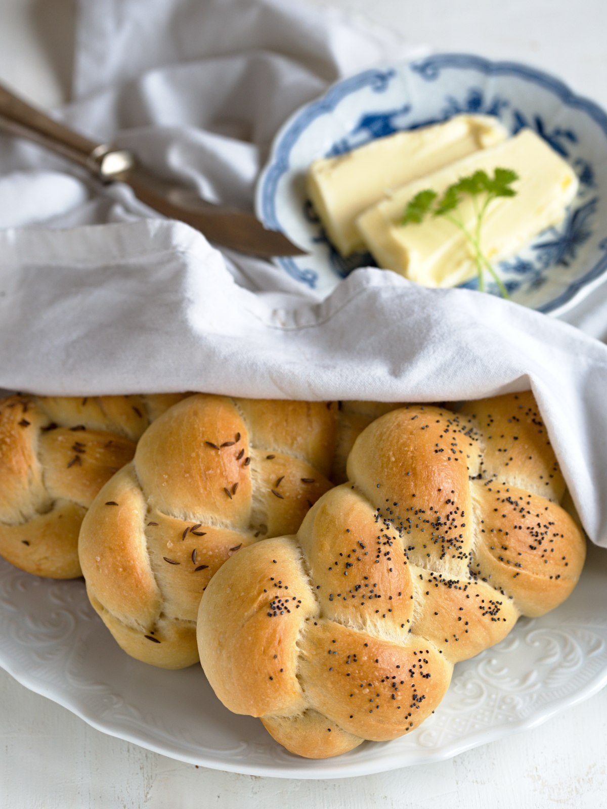Housky braided rolls served on a plate.