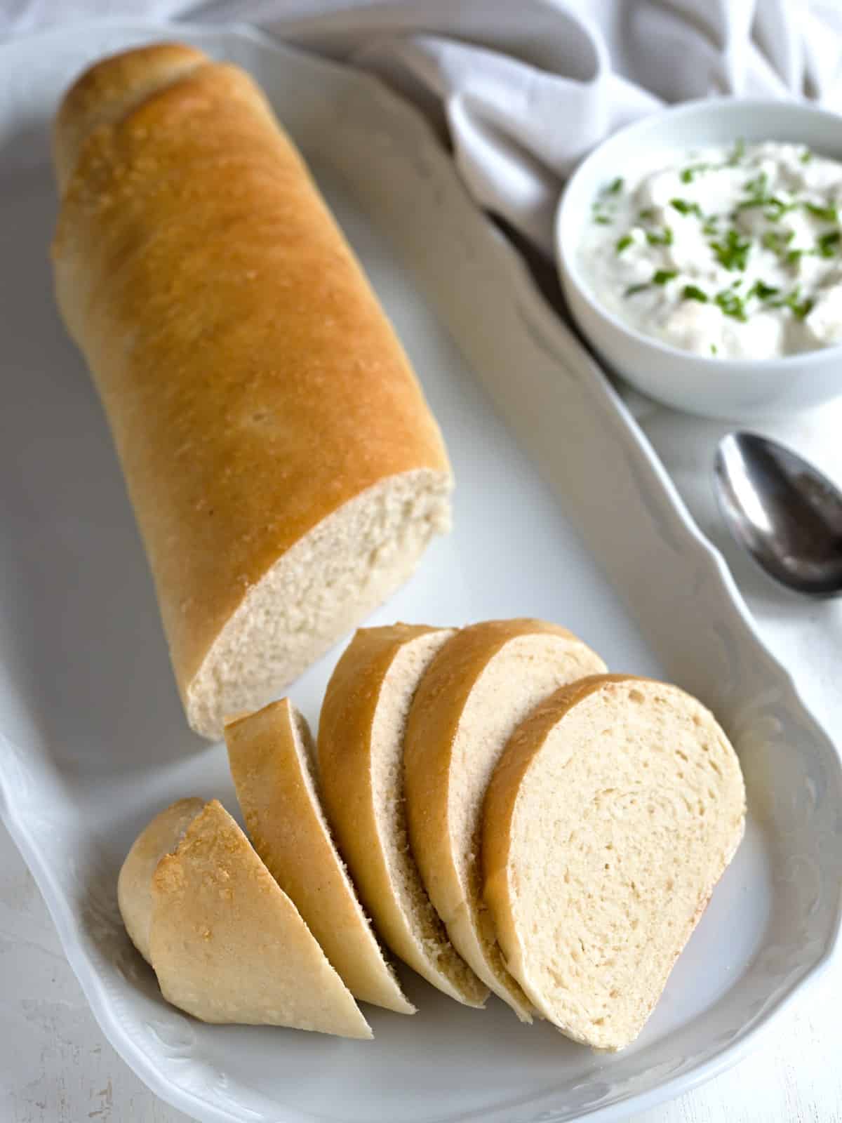 Czech veka white wheat bread slanted slices.