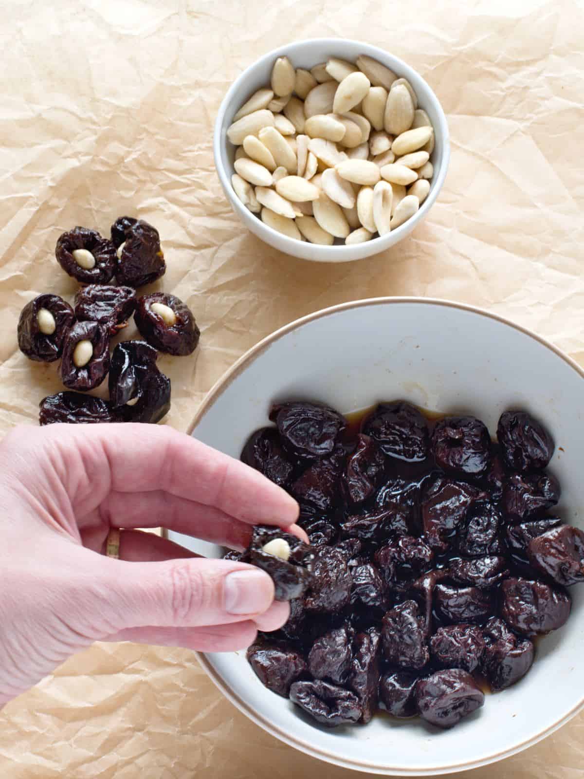 Stuffing prunes with almonds.