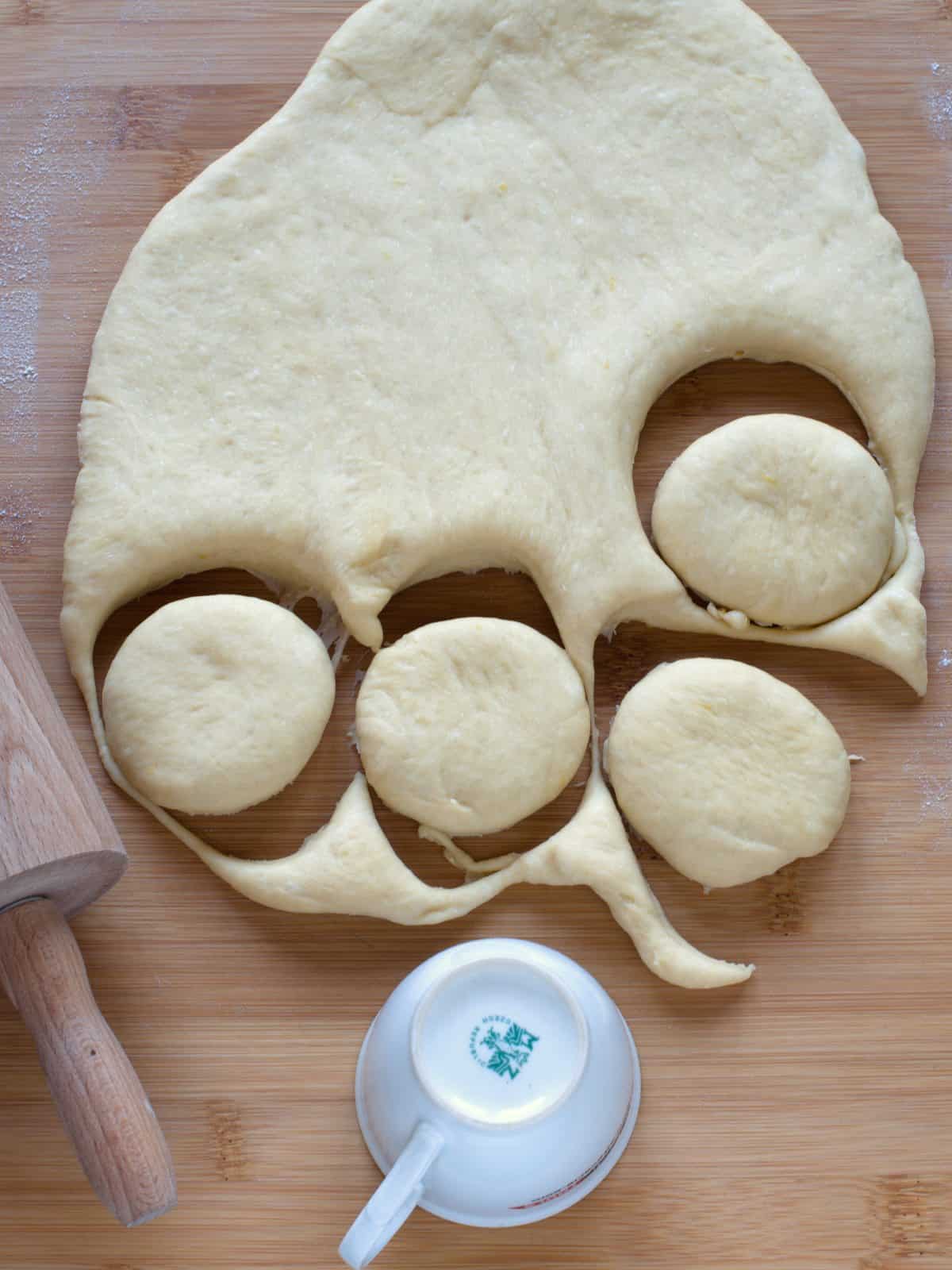 Cutting rounds from yeasted dough.