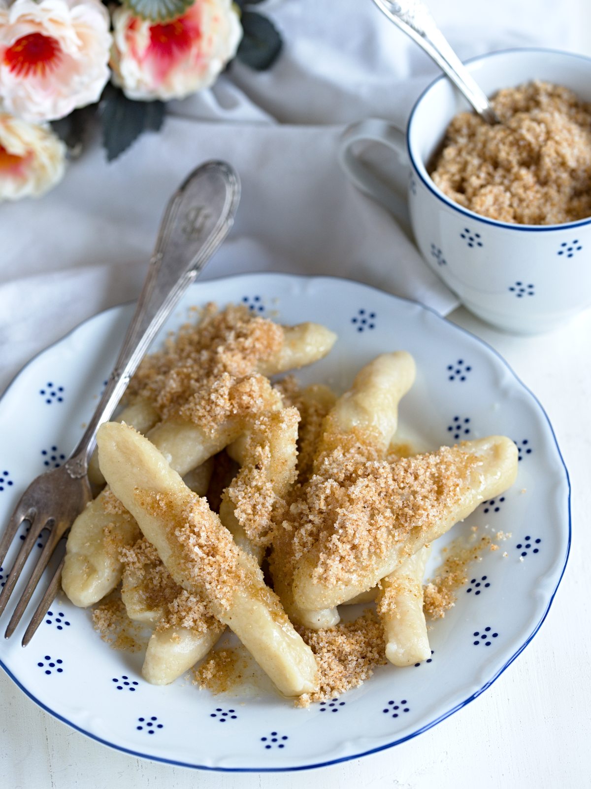 Czech sisky with fried breadcrumbs served on a plate.