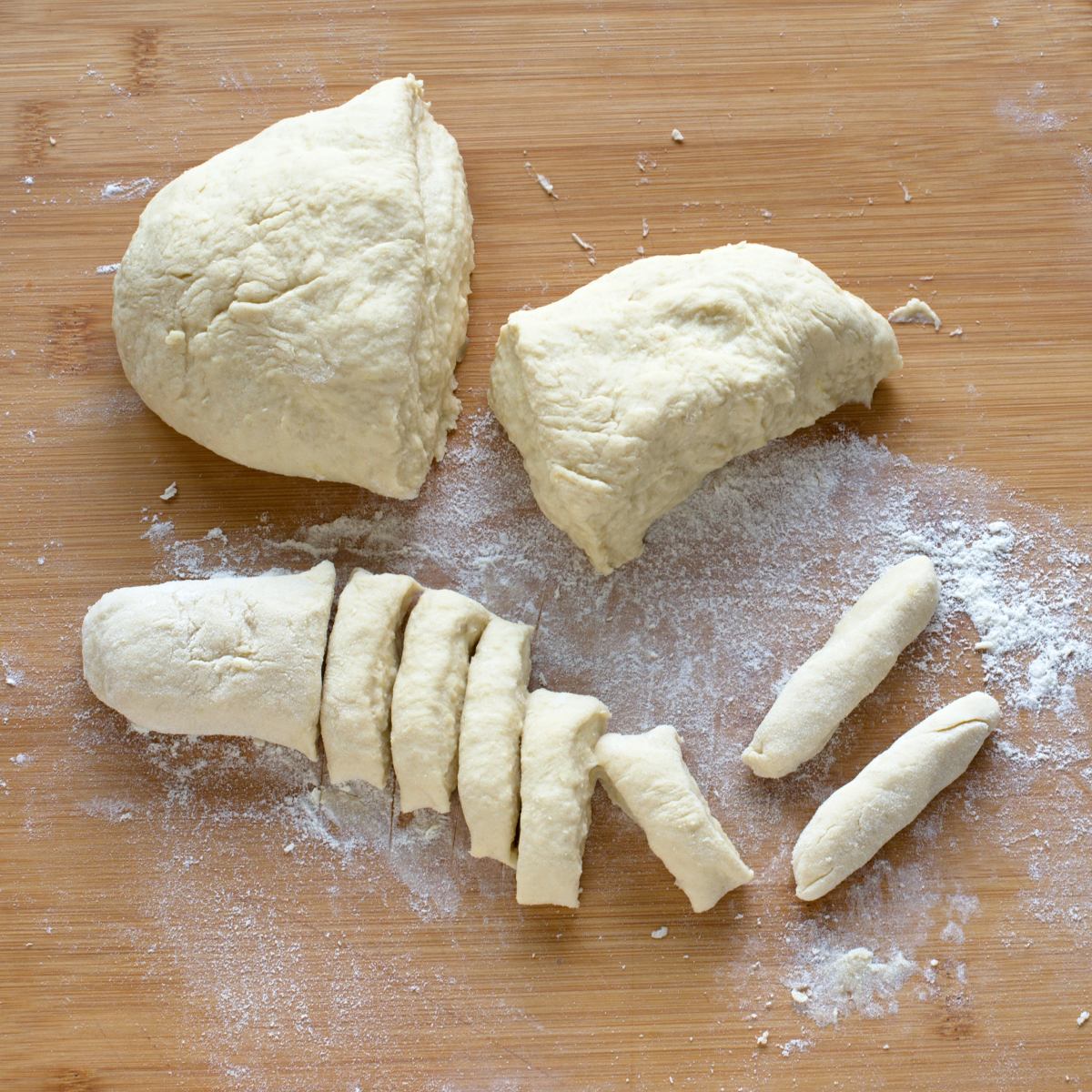 Forming potato dough into šiška shape.