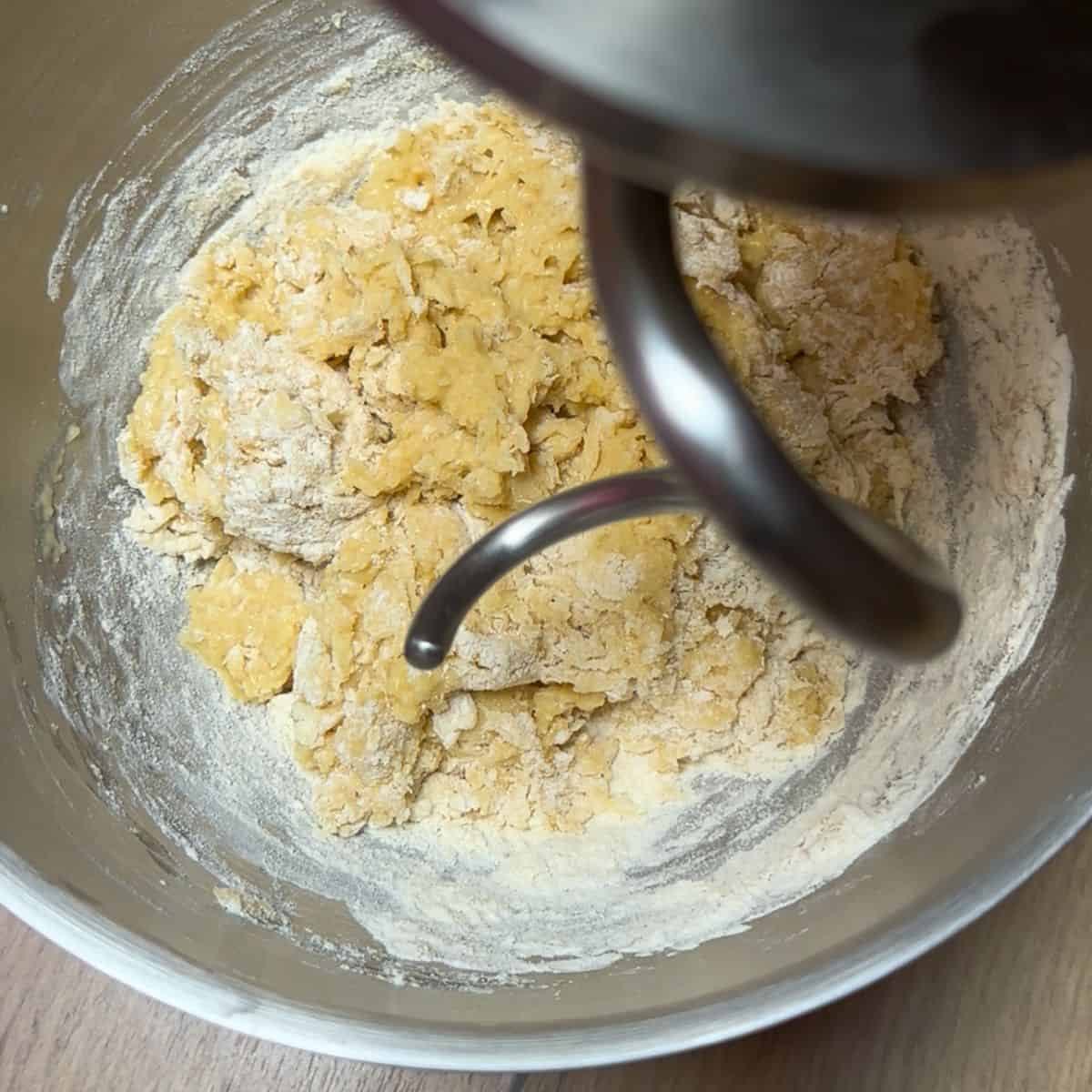 Making yeast dough with a kitchen mixer with attached hook.