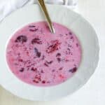 Strawberry soup served in a white bowl.