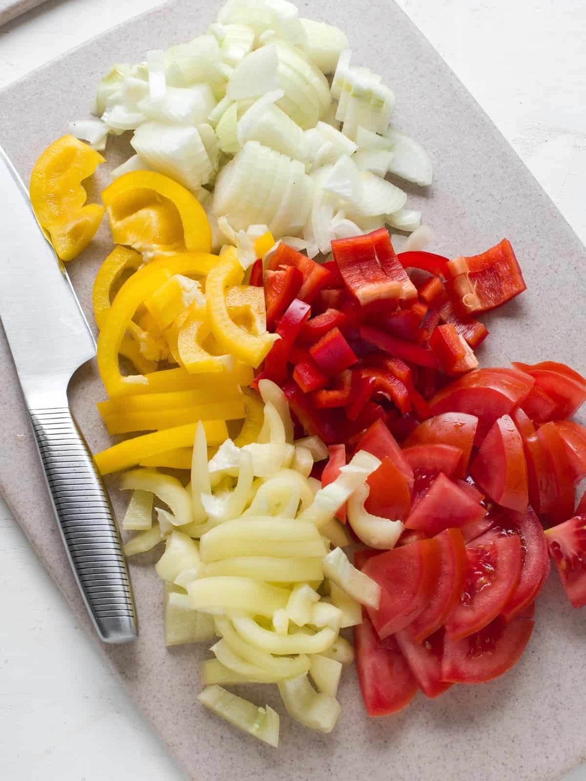 Sliced peppers, tomatoes and onion.