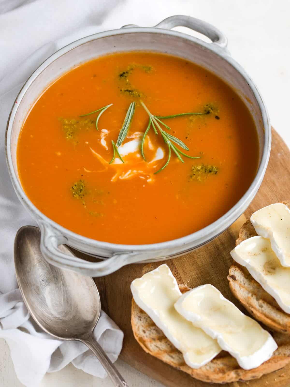 Fresh tomato soup served in a bowl with cheesetoast.