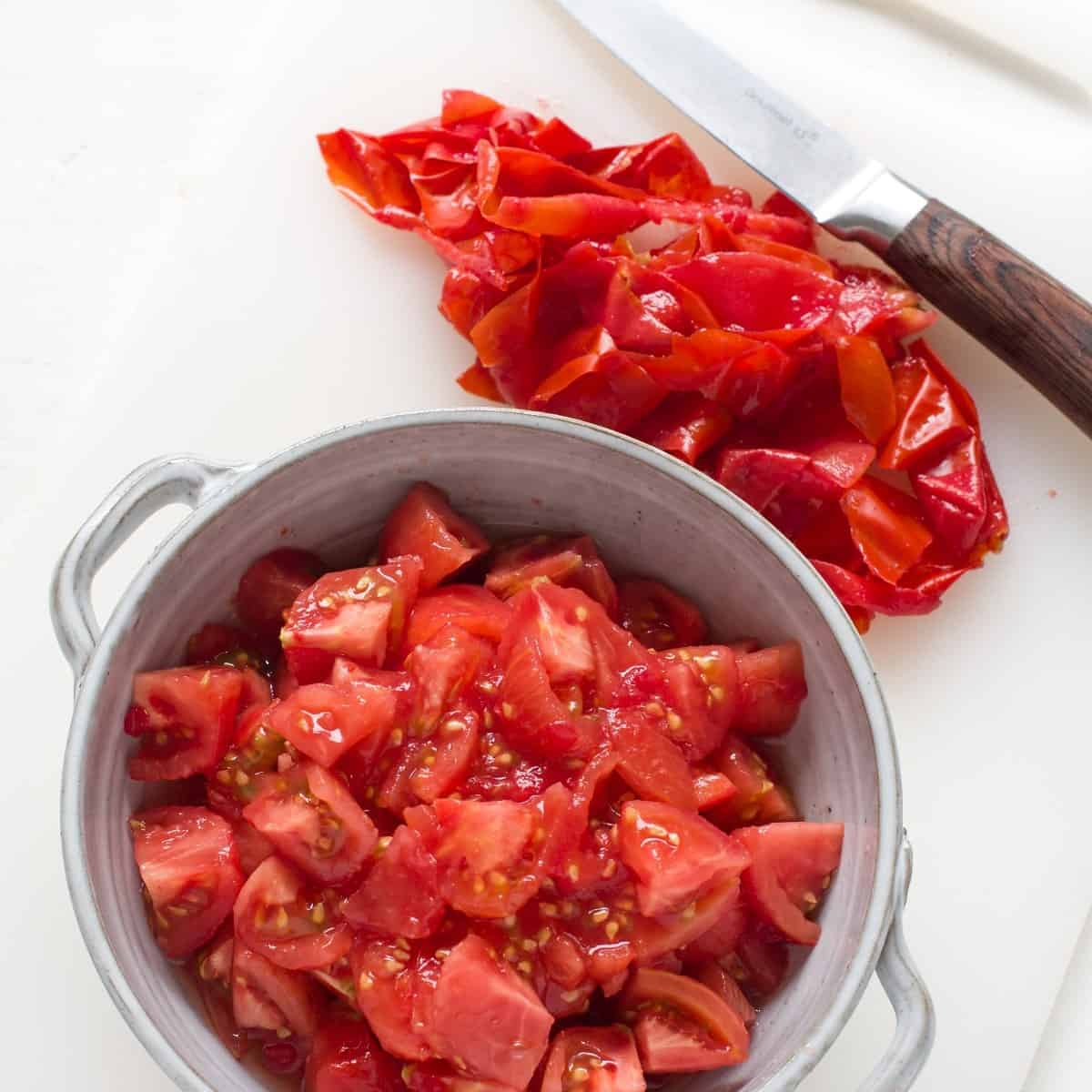 Peeled and chopped tomatoes in a bowl.