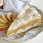 Slice of a apple jelly cake with a fork.