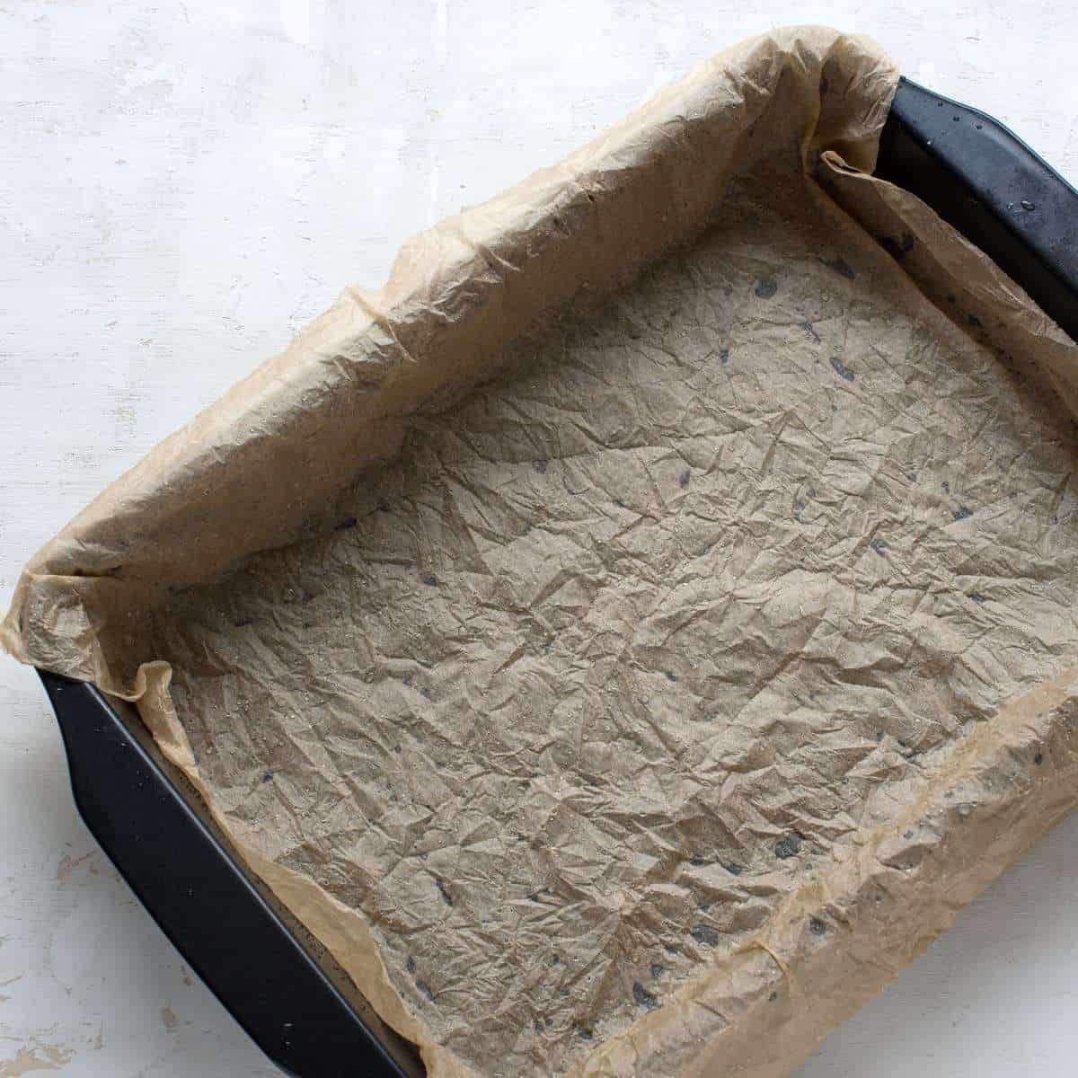 Baking dish lined with wet parchment paper.
