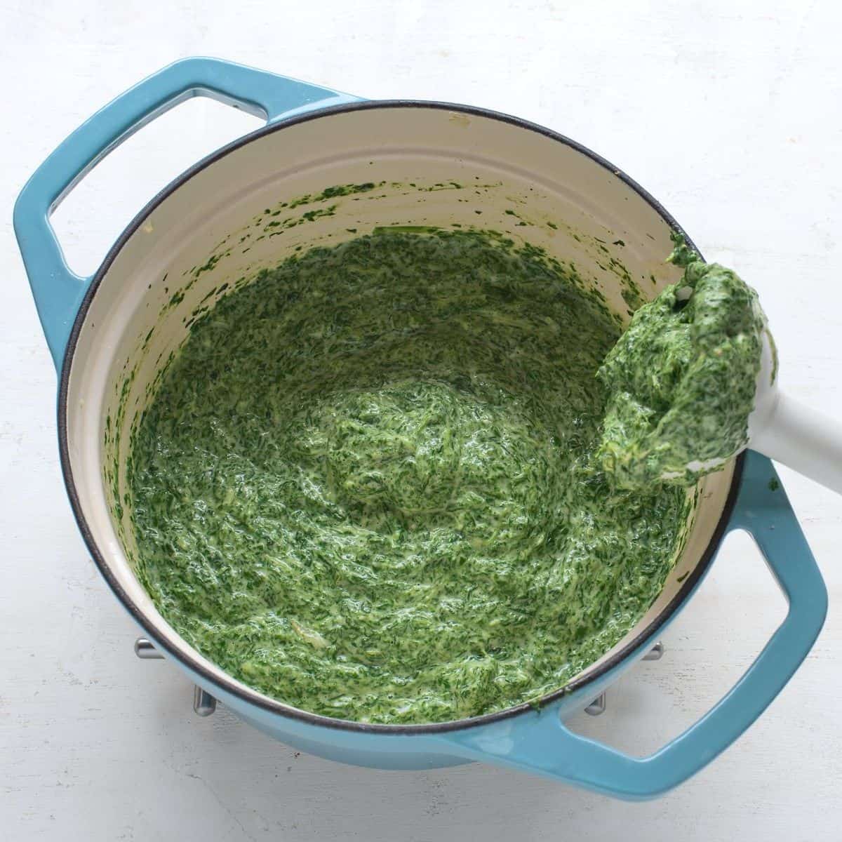 Blended creamy spinach in a pot.