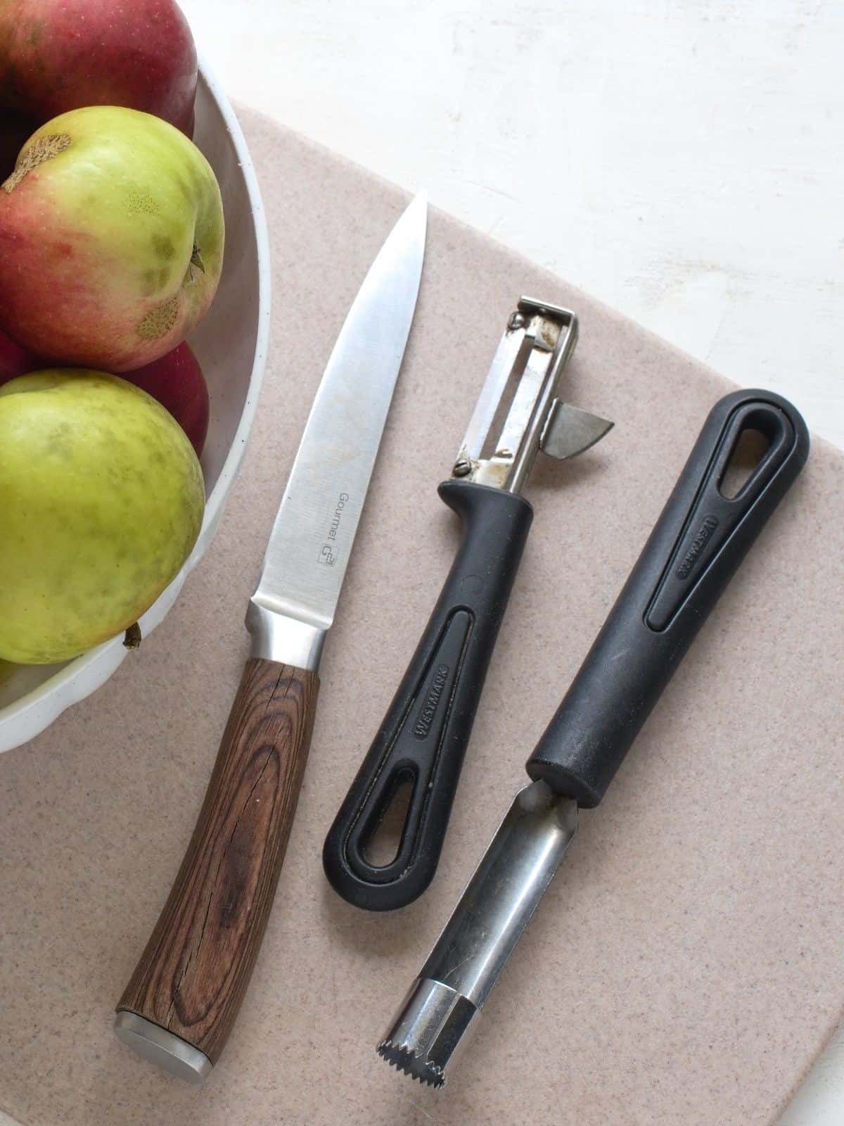 Kitchen tools needed for preparing apples for dehydrating.