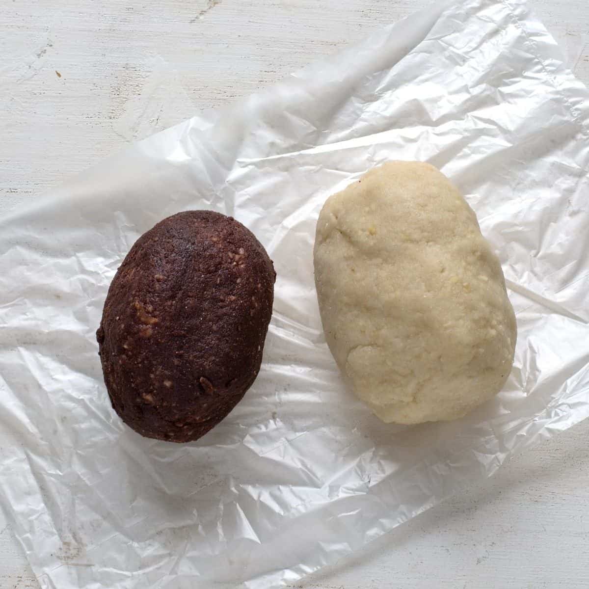 Marzipan dough, left cocoa colored and a white part on the right.
