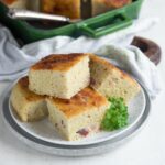 Czech Bac savory potato cake sliced and served on a plate.