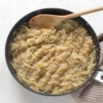 Braised sweet and sour kohlrabi in a skillet.
