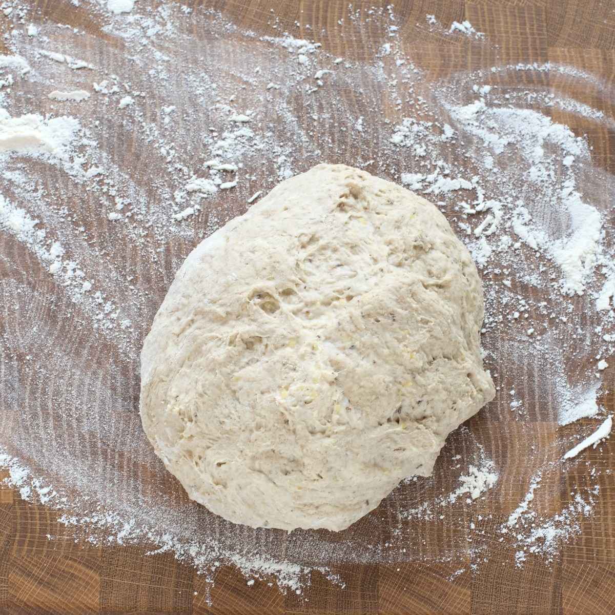 Bread dough on a floured working surface.