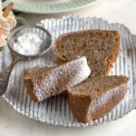 Sliced walnut bundt cake, three pieces served on a plate.