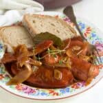 Sausages in beer gravy served with bread.
