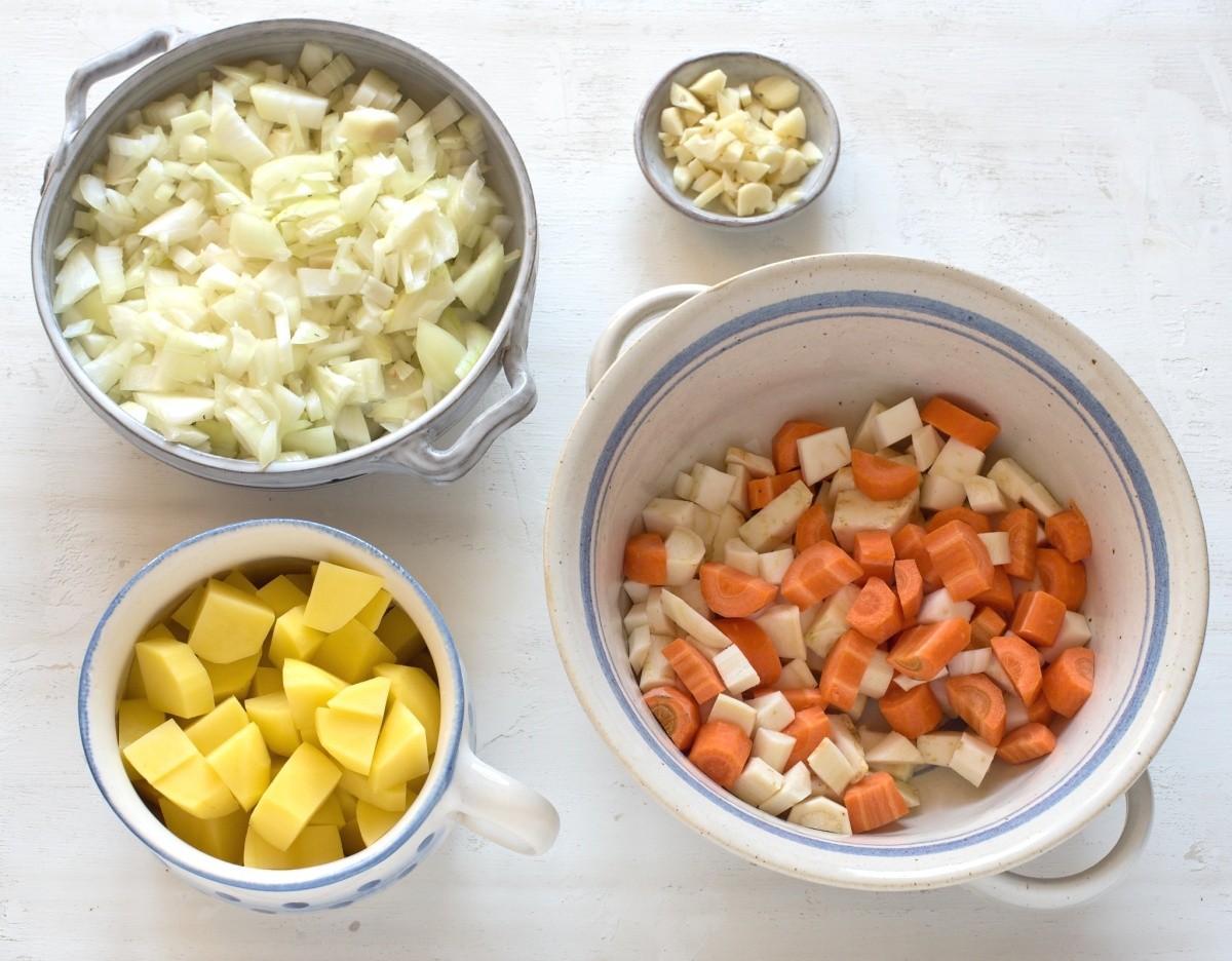Cut vegetables for Czech potato soups, in bowls.