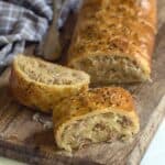 Sliced puff pastry strudel filled with sauerkraut and bacon.