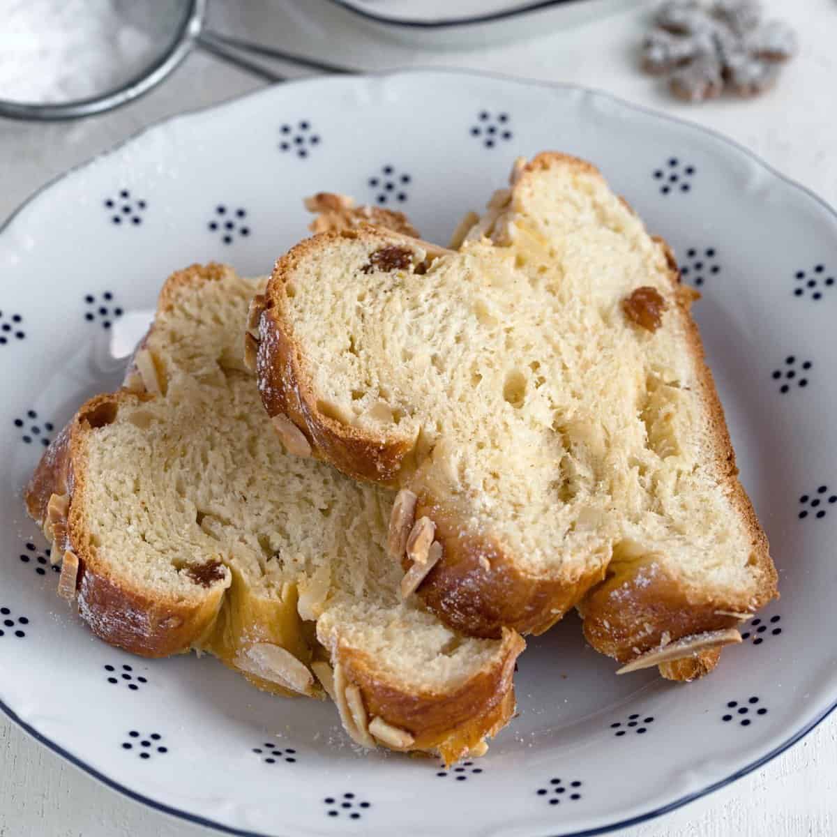 Slices of Czech houska bread, served on a dessert plate.