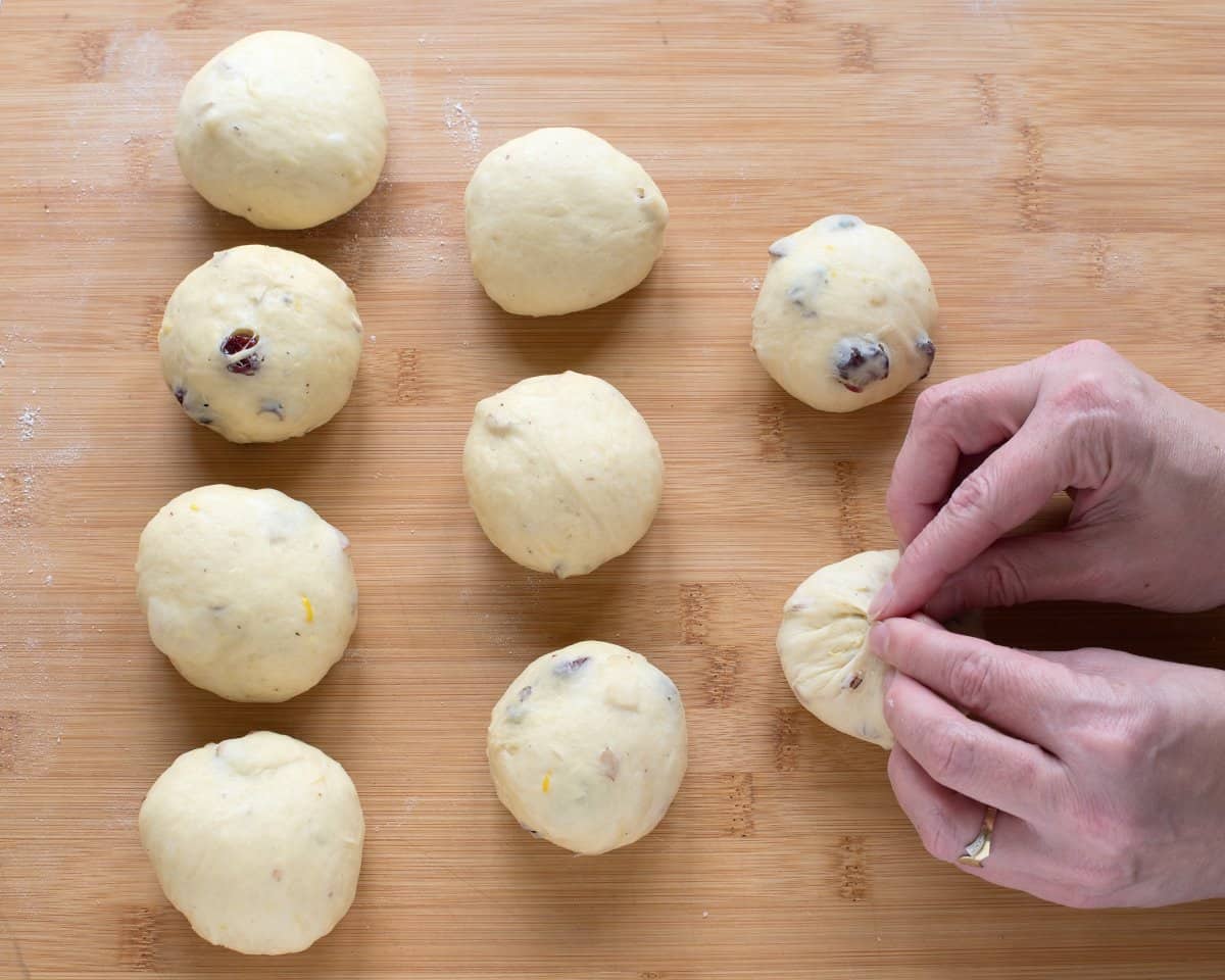 Making balls of yeast dough, that will create strands for braiding Czech vánočka.