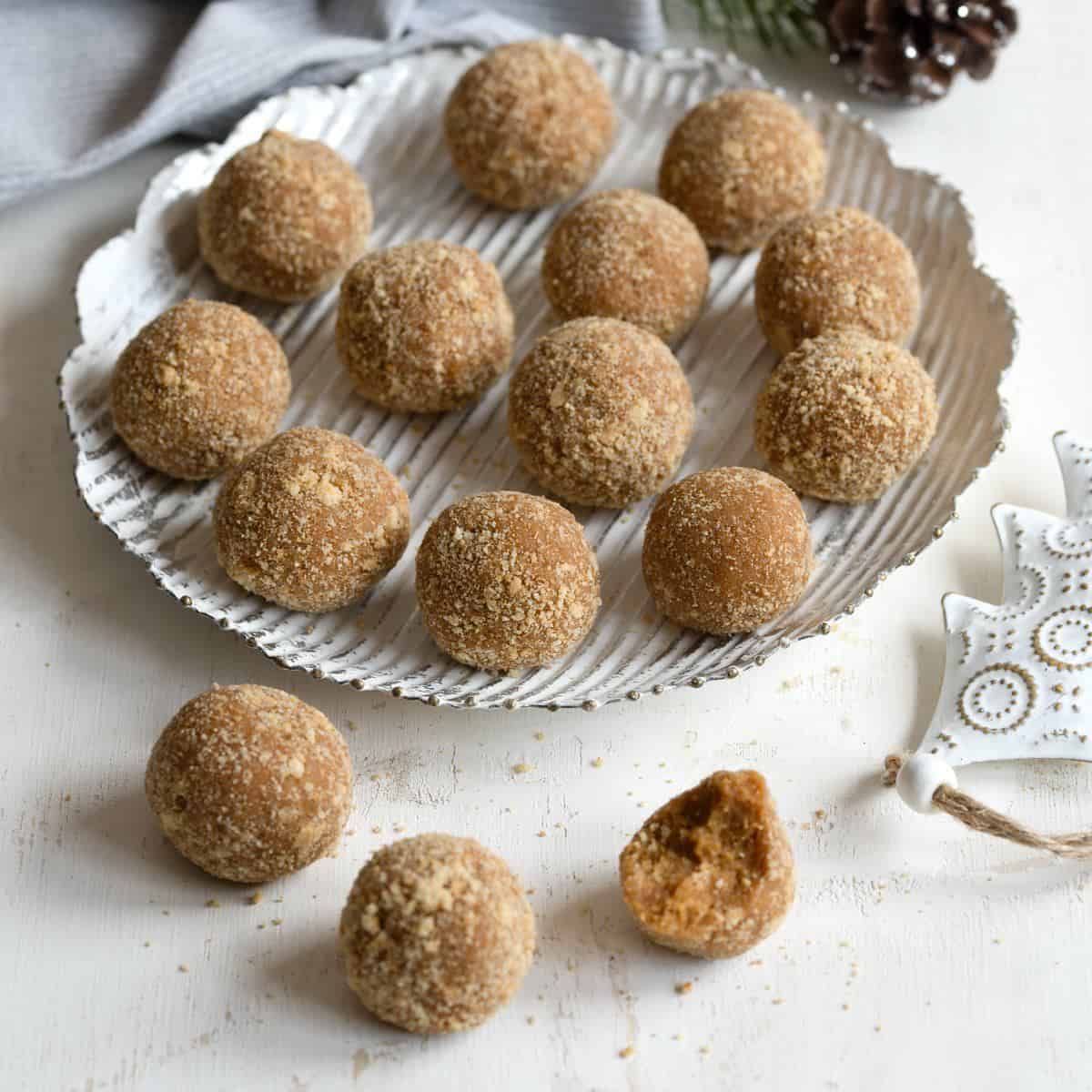Honey Balls (Medovníkové koule), traditional Czech no-bake Christmas cookies, beautifully arranged on a cookie platter.