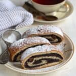 Three pieces of Czech poppy seed roll served on a plate.