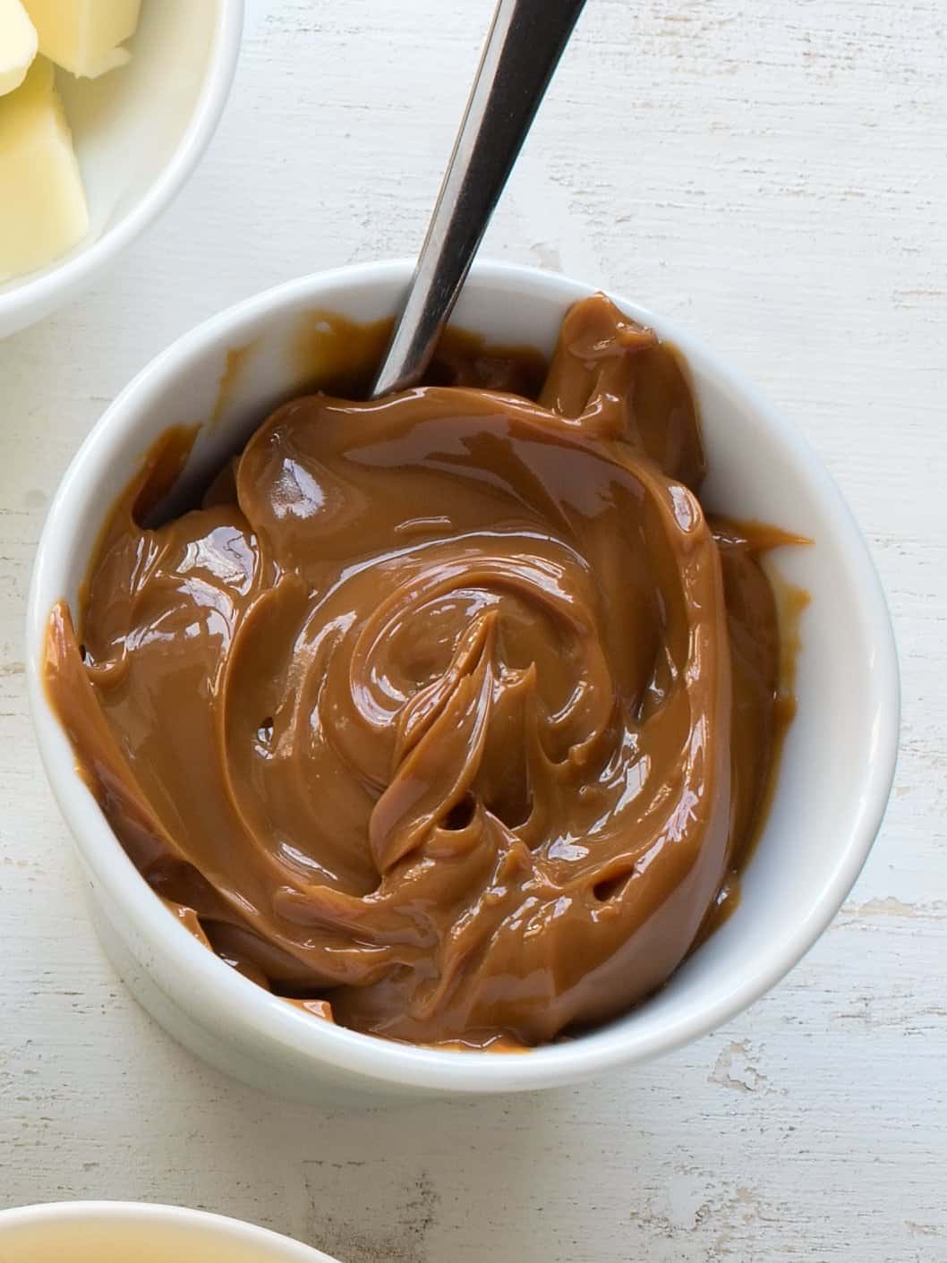 Caramelized sweetened condensed milk in a white bowl.
