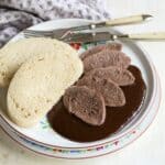 Sliced beef tongue served with bread dumplings and plum butter sauce.