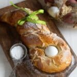 Czech sweet braided Easter bread, served on a wooden board.