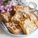 Czech apricot sheet cake sliced, served on a plate.