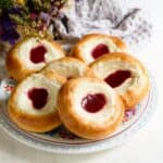 Czech farmers cheese kolache with a spoon of strawberry jam.