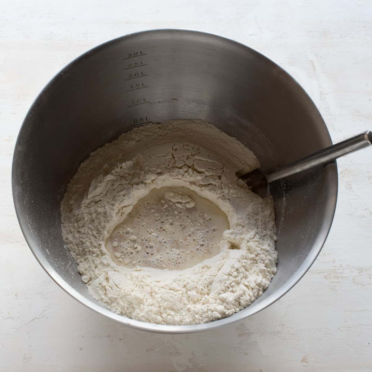 Activating yeast in a bowl.
