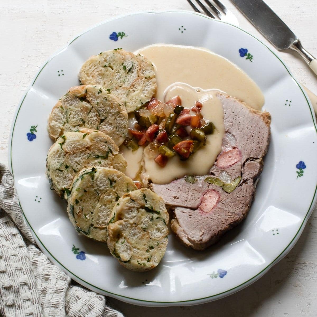 Carlsbad dumplings with Hamburg sauce and larded pork.