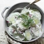 Czech cucumber salad with sour cream and dill.