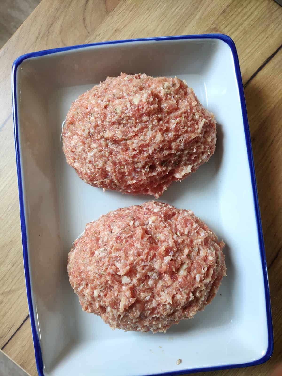 Two loaves of Czech sekaná meatloaf before baking.