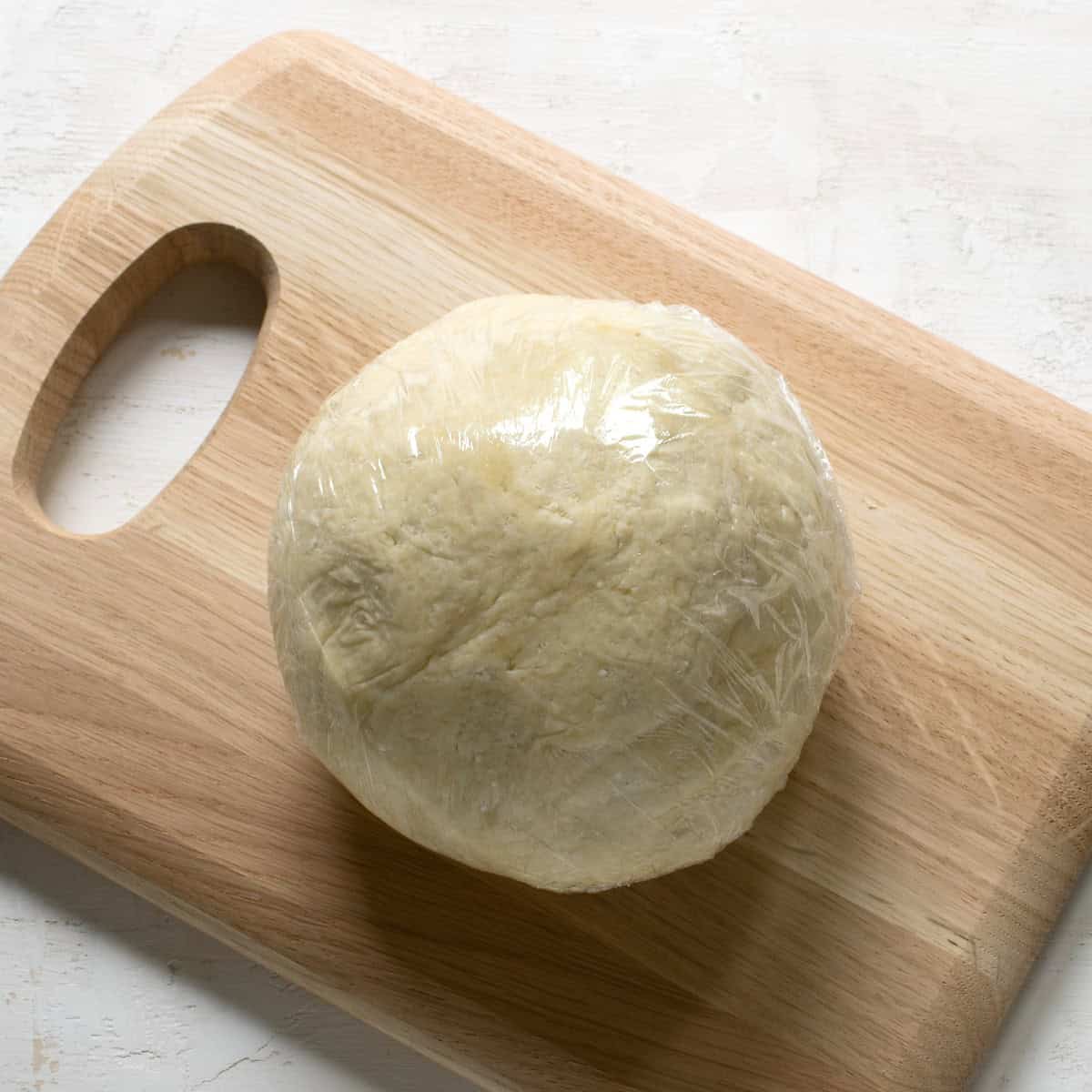 Ball of cheese dough wrapped in foil.