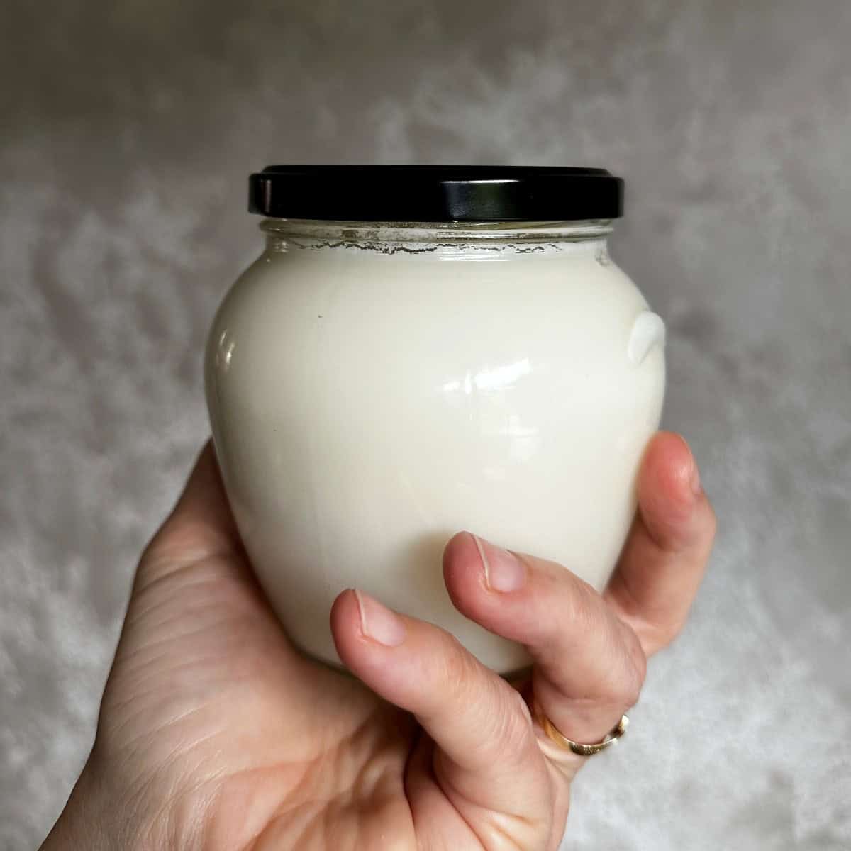 White solified lard in a glass. Czech sádlo.